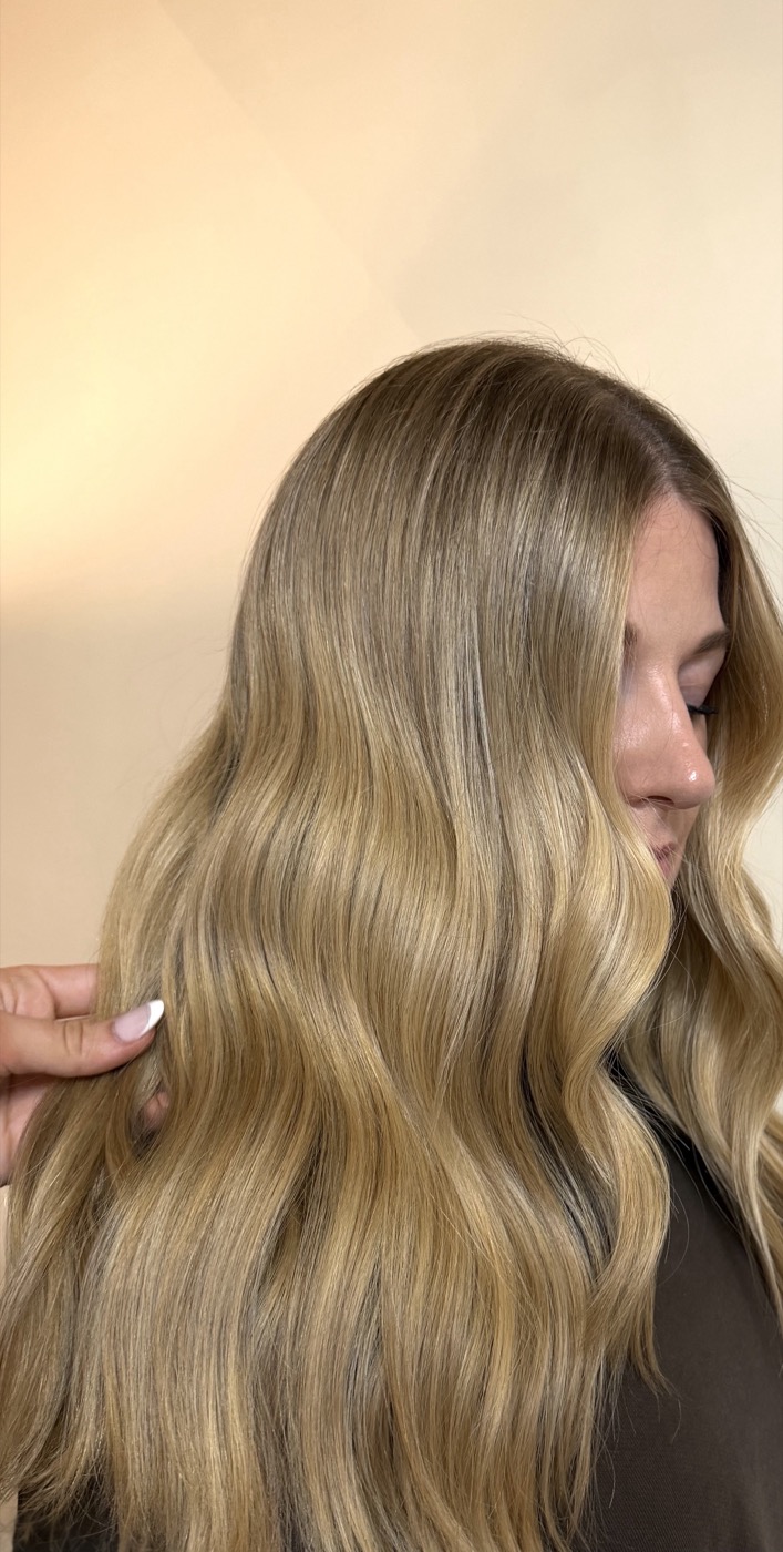 Golden blonde balayage with soft waves